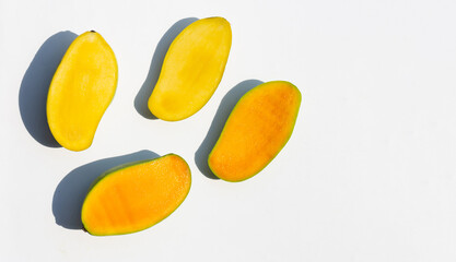Half cut ripe mango fruits on white