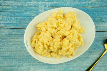 Top view of full of scrambled eggs in dish