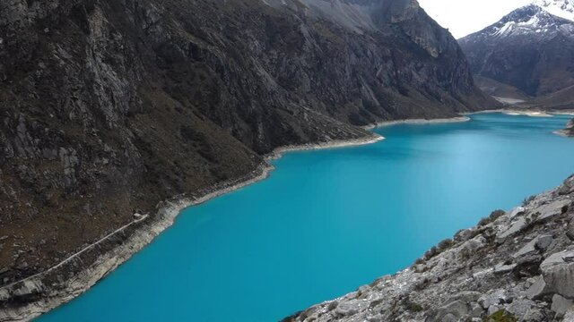 Paron lagoon, at Huascaran National Park, Peru. A blue lake in the Cordillera Blanca on the Andes. wide shot.