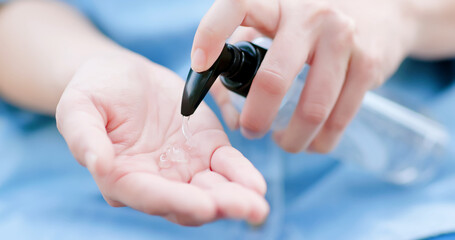 woman use hand sanitizer gel