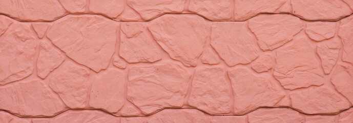 Peach-pink color concrete wall.Urban stylish background.Construction material.Heavy solid wall.Modern design.