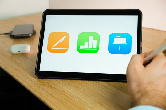 Apple iWork on the screen of iPad tablet. March 2021, San Francisco, USA