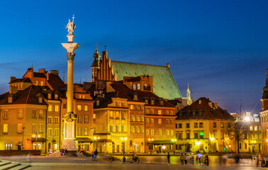 Evening panorama of Castle Square with Sigismund III Waza column and colorful tenement houses in Starowka Old Town historic district of Warsaw, Poland