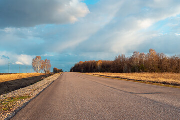 Road and beautiful sunset with clouds.
