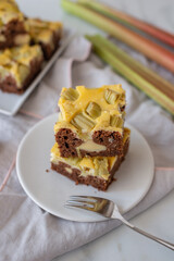 home made rhubarb cheesecake brownie on a table