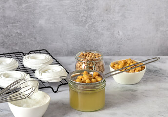 Vegan cooking concept. Meringue from canned chickpea water aquafaba. Healthy product. Eggs replacement and substitute. Top view, copy space for recipes.