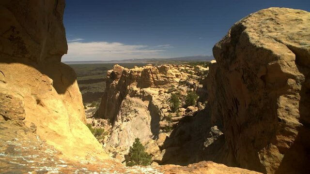 Sandstone Bluffs, El Malpais National Monument in the desert of New Mexico is a beautiful landscape made of Dakota Sandstone that contrasts with the dark lava flows farther below. Mount Taylor view.