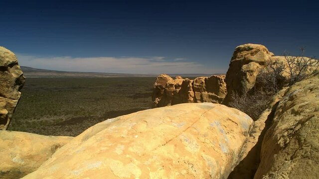 Sandstone Bluffs, El Malpais National Monument in the desert of New Mexico is a dramatic landscape made of Dakota Sandstone that contrasts with the dark lava flows below.