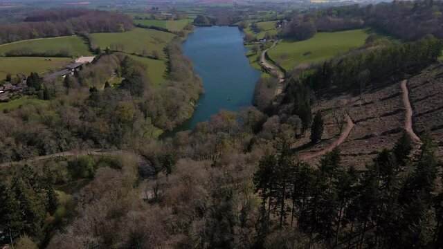 4K flying over hawkridge reservoir, drone moving forward over the trees towards to the water reservoir, 60fps.