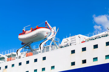 Rescue boat, safety equipment of a cruise ship - obrazy, fototapety, plakaty