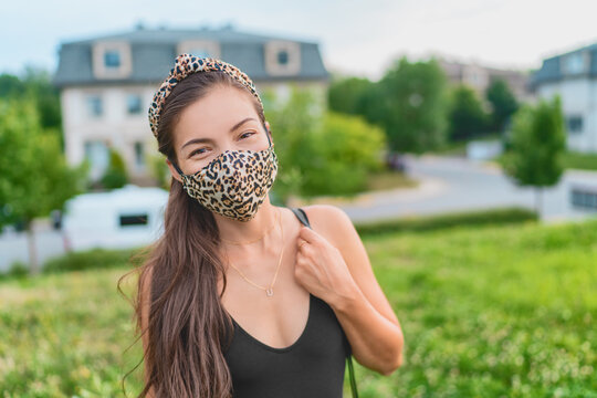 Asian woman wearing face mask casual summer portrait coronavirus people lifesytle. Fashion ppe leopard print fabric. Beauty model.
