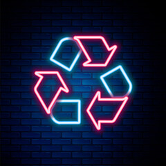 Glowing neon line Recycle symbol icon isolated on brick wall background. Circular arrow icon. Environment recyclable go green. Colorful outline concept. Vector