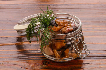 Pickled honey mushrooms in the glass