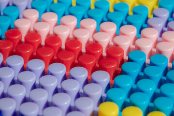 Obraz premium children's play background: the plane of plastic multi-colored bricks, blur, selective focus