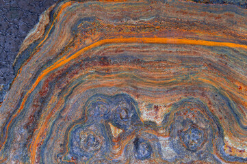 grunge background: curly rust on an old metal surface, toning
