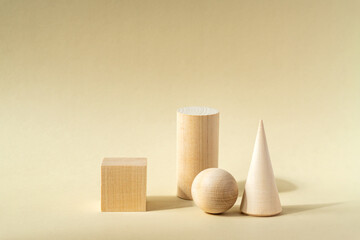 Conceptual Background with light wooden podiums and wooden ball on beige background for branding and packing presentation of your product. Trendy still life on monochrome tones.