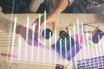 Double exposure of man and woman working together and financial chart hologram drawing. market analysis concept. Computer background. Top View.