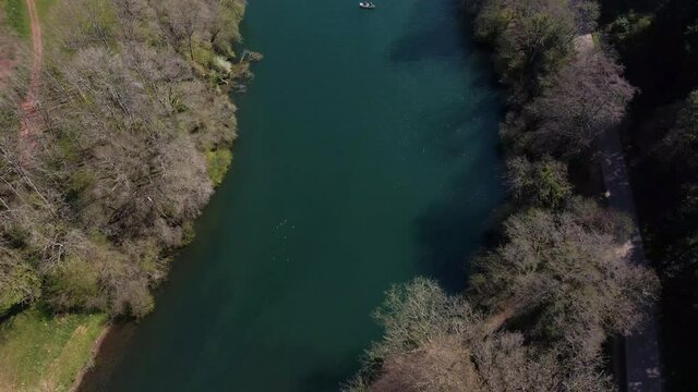 4K flying over hawkridge reservoir, drone moving backwards over the water, 60fps.