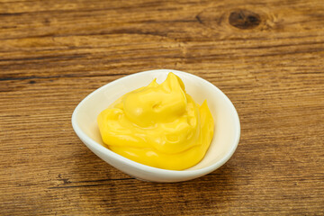 Natural cheese sauce in the bowl