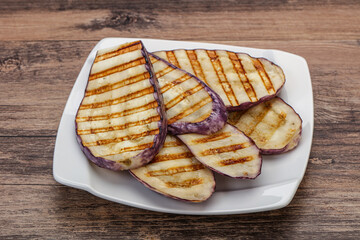 Grilled graffiti eggpant slices with oil