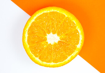 Close up photo of Orange Fruit on the white and orange background. Citrus cut in half, inside, macro view. Minimalism, original and creative image. Beautiful natural wallpaper.