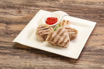 Grilled pork tenderlion with tomato sauce
