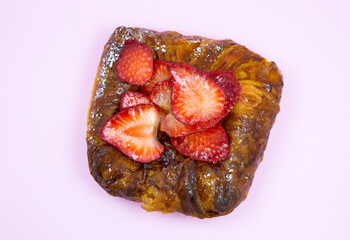 Puff pastry bun or roll. Cake with fresh strawberries. Delicious sweets temptation and desserts on...