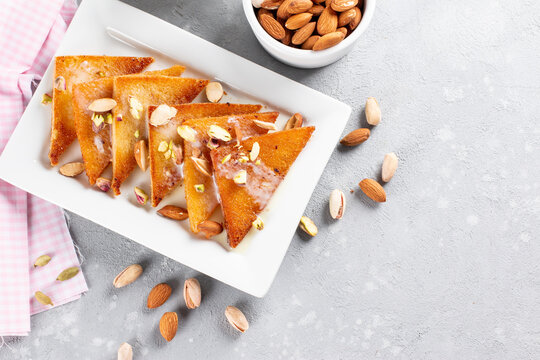 Homemade bread pudding with Condensed Milk and nuts, selective focus. Top view. Copy space