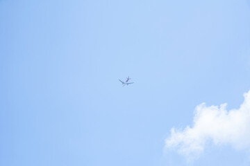 Airplane flying in the blue sky