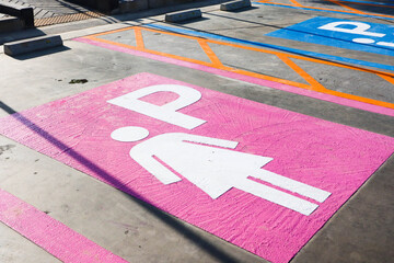 Lady parking sign painted on the floor in Public place.