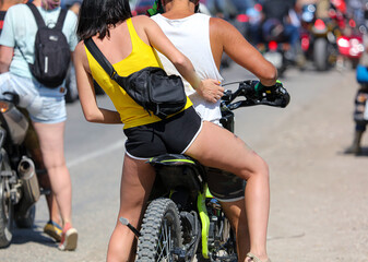 A man and a girl on a bike in motion