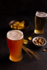 A glass of cold beer and snacks