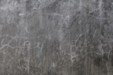 Cracks on the loft-style cement plaster walls background.