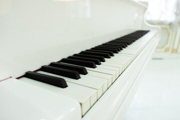 white grand piano with keys close-up. classical music