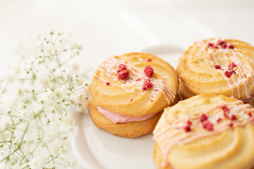 selection of sweet baked cream edible flowers and fruit dessert cakes for mothersday, wedding, birthday, paerty celebration. viola odorata cake. 
