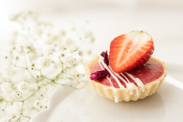 selection of sweet baked cream edible flowers and fruit dessert cakes for mothersday, wedding, birthday, paerty celebration. viola odorata cake. 