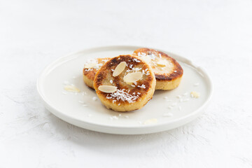 Tofu pancakes in a plate on a light background. Vegan food, sugar, gluten and lactose free.