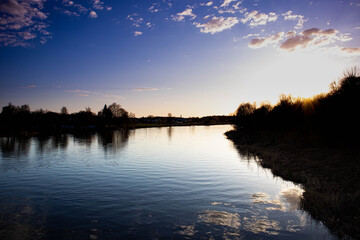 Spring sunset by the river in Carnikava, Latvia