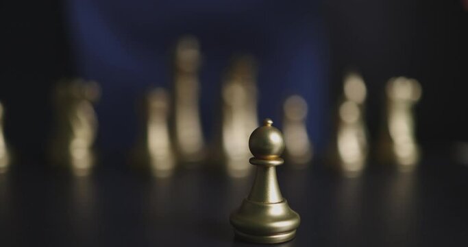 4K Video slow motion close up businessman hand in suit place pawn chess at front. business concept of business strategy and management.