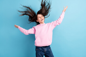 Photo of lovely cute long hair girl look empty space wear pink sweatshirt isolated on blue background