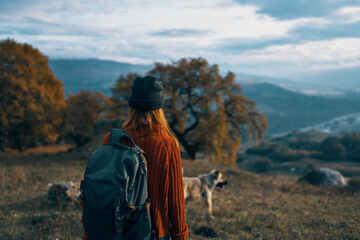 woman hiker backpack travel mountains landscape trip