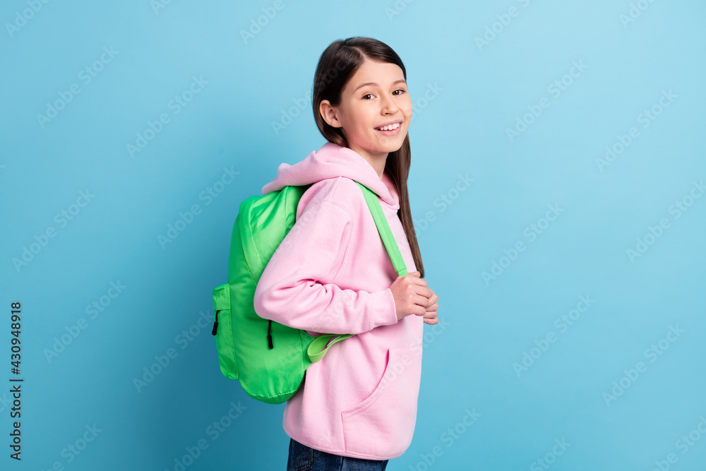 Sticker Profile side photo of young preteen girl happy positive smile pupil wear backpack isolated over blue color background