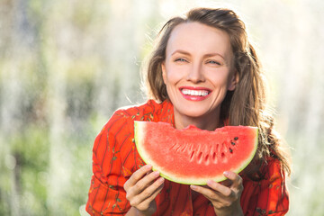 Beautiful woman eating watermelon	