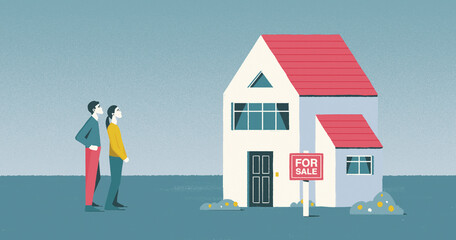 Young couple looking at house for sale