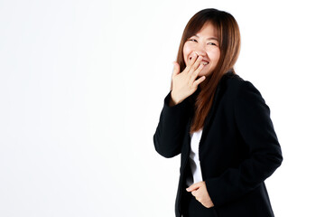 Young and fresh new graduated look Asian businesswoman in suit pose using hand cover mouth while laughing and feel humor on white background