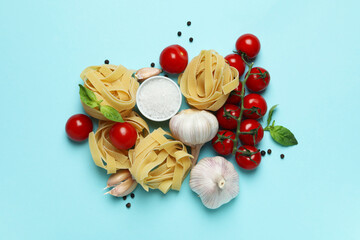 Fototapeta na wymiar Concept of cooking tasty pasta on blue background