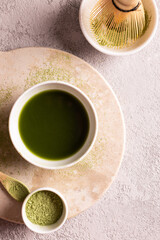 Obraz na płótnie Canvas Powdered green tea matcha on a white stone board