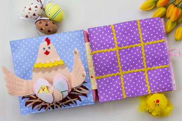 Handmade textile book for baby. Easter present for baby. Pages with felt eggs, birds and rabbits. Woolly toys on a string. Baby development. Educational toys. Fine motor skills.