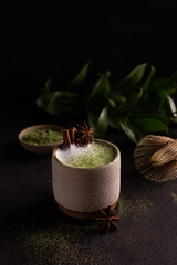 Cup of matcha latte with spices