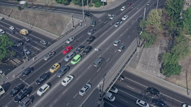 Traffic and accidents on the two-level six-lane highway - airial shot. Plenty of cars in the city on a big city highway.